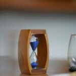 Hourglass with sand running out representing Parkinsons Law and deadlines.